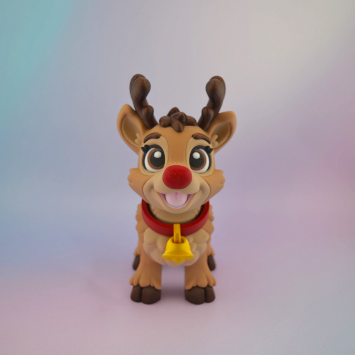3D printed Christmas reindeer with big brown eyes, a bright red nose, brown antlers and a red collar with a golden bell.