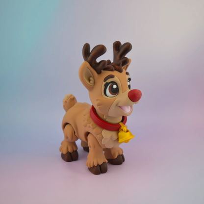 3D printed Christmas reindeer with big brown eyes, a bright red nose, brown antlers and a red collar with a golden bell.